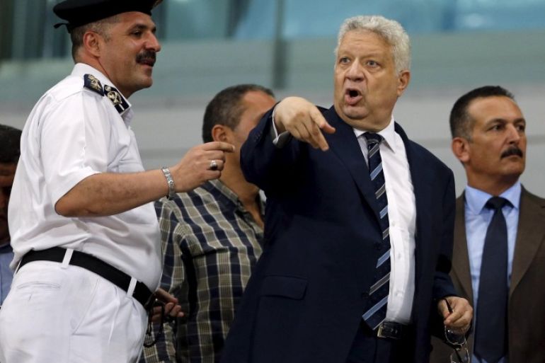 El Zamalek Chairman Mortada Mansour (C) argues with security during their Egyptian Premier League derby soccer match against Al-Ahly at Borg El Arab "Army" Stadium, west of the Mediterranean city of Alexandria, July 21, 2015. The match was played without spectators due to security reasons. REUTERS/Amr Abdallah Dalsh