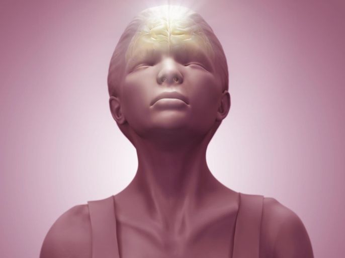Close up of female anatomical model meditating with the brain visible in the body.