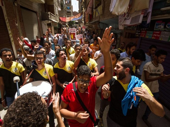 FILE - In this Friday, Aug. 7, 2015 file photo, Ultras Rabawi, young members of the Muslim Brotherhood, take part in a protest against what they call the military regime in Egypt, calling on others to join them in a protest the following week, in the El-Mataria district of Cairo. (AP Photo/Belal Darder, File)