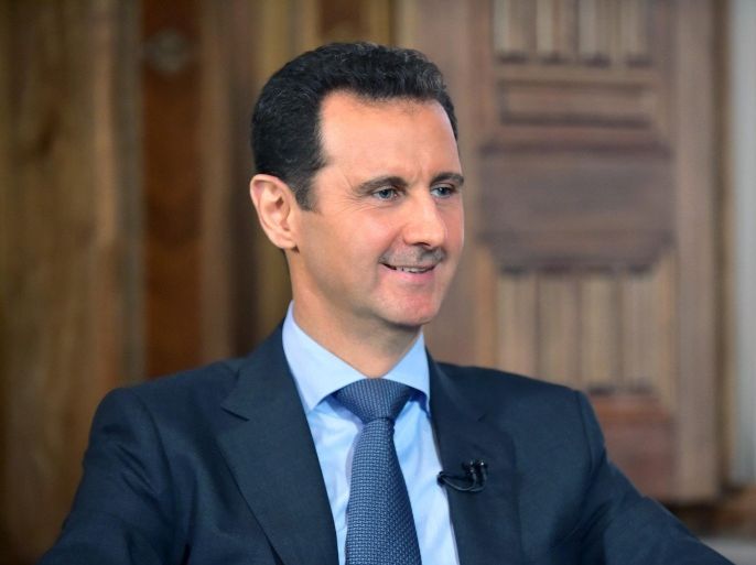 A handout picture released by Syria's official Syrian Arab News Agency (SANA) on 25 August 2015 of Syrian President Bashar al-Assad during a television interview with the Lebanese Al-Manar TV in Damascus, Syria, 24 August 2015. EPA/SANA / HANDOUT