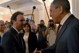 Russian Foreign Minister Sergei Lavrov (R) welcomes Syrian Opposition Council President Khaled Khoja during their meeting in Moscow on August 13, 2015. AFP PHOTO / KIRILL KUDRYAVTSEV