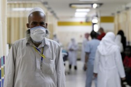 A Muslim pilgrim wears a protective mask in the emergency department at Al-Noor Specialist Hospital in Mecca September 30, 2014. According to hospital director Dr. Mohammad bin Omar, the hospital did not record any cases of pilgrims bearing the MERS coronavirus or Ebola virus entering Mecca for the Haj season, and that most of the cases referred to the hospital were of elderly patients with common ailments. REUTERS/ Muhammad hamed (SAUDI ARABIA - Tags: RELIGION HEALTH)