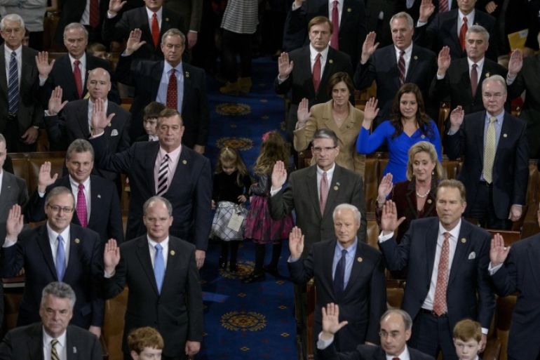 Members of the House are sworn in during a ceremony on the floor of the House of Representatives as the 114th Congress convenes on Capitol Hill January 6, 2015 in Washington, DC. Republican John Boehner was re-elected and sworn in Tuesday as speaker of the US House of Representatives, overcoming a surprisingly robust attempt to oust him by two dozen hardcore conservatives. Boehner received 216 of the 408 votes cast in the chamber, winning as expected over Democrat leader and former House speaker Nancy Pelosi, who received 164 votes. AFP PHOTO/BRENDAN SMIALOWSKI
