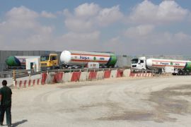 KEREM SHALOM, ISRAEL - AUGUST 28: Fuel tanks brought by articulated lorries for Palestinians, in Kerem Shalom Border Gate, Israel on 28 August, 2014.