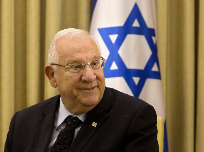 Israel's President Reuven Rivlin, smiles during his meeting with German Foreign Minister Frank-Walter Steinmeier at the President's residence in Jerusalem, Sunday, May 31, 2015. Steinmeier is on an official visit to the region. (AP Photo/Sebastian Scheiner)