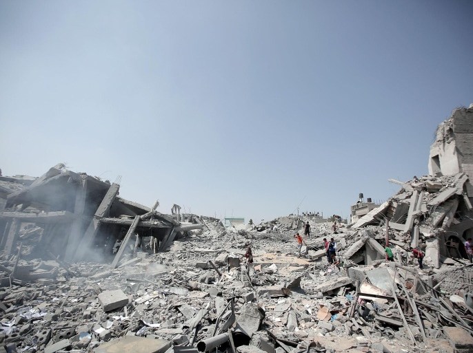 GAZA CITY, GAZA - AUGUST 02: Palestinians inspect the rubble of the Imam Shafi'i mosque destroyed in Israeli airstrikes, in the Zeitoun neighborhood of Gaza City, on August 02, 2014. At least 50 Palestinians were killed in Israeli attacks in the Gaza Strip on Saturday, taking the overall death toll to 1650, according to a Health Ministry spokesman.