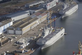 The two Mistral-class helicopter carriers Sevastopol (Bottom) and Vladivostok are seen at the STX Les Chantiers de l'Atlantique shipyard site in Saint-Nazaire, western France, May 25, 2015. Tensions between the West and Russia over Ukraine have blocked a deal in which Moscow was to buy the ships, leaving Paris trying to negotiate a face-saving compromise and work out what to do with two unwanted warships. Photo taken May 25, 2015. REUTERS/Stephane Mahe