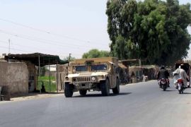 An Afghan National Police armored vehicle patrols on a street in Lashkar Gah capital of Helmand province, Afghanistan August 26, 2015. The Taliban seized a district headquarters in Afghanistan's Helmand province on Monday despite U.S. air strikes to repel them, and two NATO soldiers were shot dead by uniformed men on an army base in the area, a stronghold for militants and opium. REUTERS/ Stringer