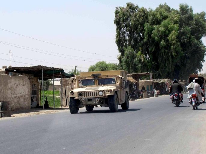 An Afghan National Police armored vehicle patrols on a street in Lashkar Gah capital of Helmand province, Afghanistan August 26, 2015. The Taliban seized a district headquarters in Afghanistan's Helmand province on Monday despite U.S. air strikes to repel them, and two NATO soldiers were shot dead by uniformed men on an army base in the area, a stronghold for militants and opium. REUTERS/ Stringer