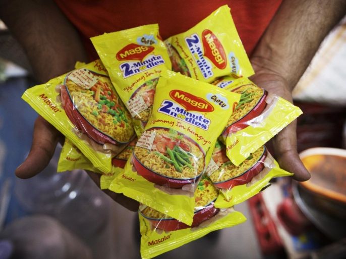 Packets of Maggi 2-Minute Noodles, manufactured by Nestle India Ltd., which were located behind the counter at a store are displayed for a photograph in New Delhi, India, on Monday, June 15, 2015. Nestle SA said the U.S. Food and Drug Administration is testing samples of imported Maggi noodles after the worlds largest food company halted sales in India when regulators said they contained unhealthy levels of lead.