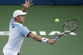 Kevin Anderson, of South Africa, returns a shot against Borna Coric, of Croatia, during a quarterfinal in the Winston-Salem Open tennis tournament in Winston-Salem, N.C., Thursday, Aug. 27, 2015. (AP Photo/Chuck Burton)