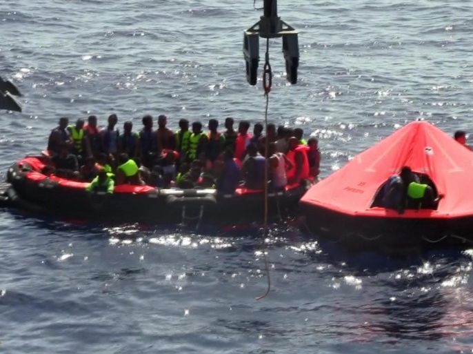 A framegrab made from a handout video released by the Irish Defence Forces on 05 August 2015 of migrants sitting in rhibs (rigid hull infraltable boats) during rescue operations by the Irish Navy patrol vessel 'Le Niamh' off the Libyan coast, 05 August 2015. A major rescue operation is under way after a boat with some 700 migrants capsized off Libya. Around 200 migrants are feared dead after a boat capsized off Libya, humanitarian agencies said. The incident took place some 22 nautical miles north of Zuwarah, a main departure point for migrants wanting to flee to Europe. EPA/IRISH DEFENCE FORCES / HANDOUT