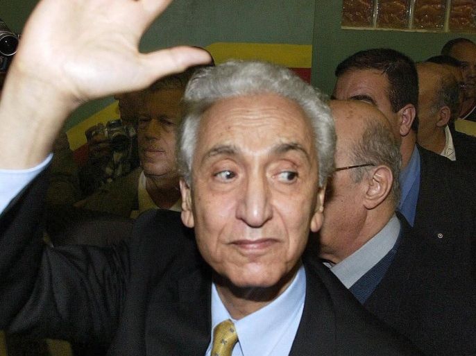 Leader of the Front des Forces Socialistes (FFS-opposition) and one of the last living historic leaders of the start of the Algerian war of independence, Hocine Ait Ahmed greets supporters 31 October 2004. Ait Ahmed announced his return to Algiers after five years abroad to moderate a conference on the Algerian social-political system.