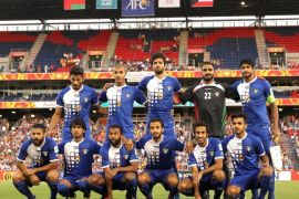 NEWCASTLE, AUSTRALIA - JANUARY 17: Kuwait team mates line up before the 2015 Asian Cup match between Oman and Kuwait at Hunter Stadium on January 17, 2015 in Newcastle, Australia.