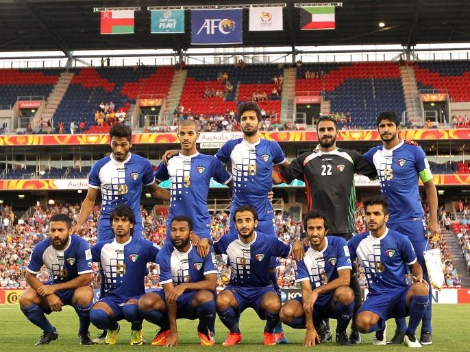 NEWCASTLE, AUSTRALIA - JANUARY 17: Kuwait team mates line up before the 2015 Asian Cup match between Oman and Kuwait at Hunter Stadium on January 17, 2015 in Newcastle, Australia.
