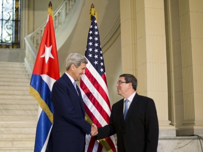 U.S. Secretary of State John Kerry (L) shakes hands with Cuban Foreign Minister Bruno Rodriguez prior to their meeting at the Foreign Ministry in Havana, Cuba, August 14, 2015. U.S. Marines hoisted the American flag at the U.S. Embassy in Cuba for the first time in 54 years at a ceremony led by Kerry marking the restoration of diplomatic relations between Washington and Havana. REUTERS/Pablo Martinez Monsivais/Pool