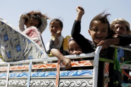 Girls ride on the back of a truck with their father as they flee their home, to Yemen's capital Sanaa, after Saudi-led air strikes hit their area in the northwestern province of Amran, August 29, 2015. Warplanes from a Saudi-led coalition killed 10 people in air raids in central Yemen on Friday, local officials said. REUTERS/Khaled Abdullah