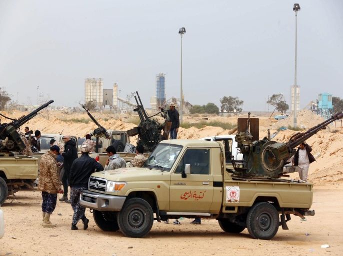 Fighters loyal to Libya's parliament General National Congress (GNC) prepare to launch attacks as they continue to fight Islamic State (IS) on the outskirts city of Sirte, Libya, 16 March 2015. According to reports, pro-government militia and fighters affiliated to the IS are fighting over control of Sirte, hometown of slain Libyan dictator Gaddafi.