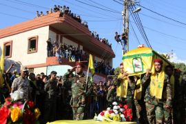 Members of Lebanon's Shiite movement Hezbollah carry the coffin of comrade, Ali Manana, who was killed in combat alongside Syrian government forces fighting against Islamic State group jihadists in Syria's Zabadani area, during his funeral procession in Lebanon's southern village of Sarafand on August 11, 2015. AFP PHOTO / MAHMOUD ZAYYAT
