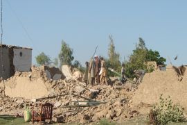 Pakistani tribesmen clear rubble and belongings from their destroyed houses following Pakistan military airstrikes against suspected Taliban hideouts in Miranshah in North Waziristan on May 24, 2014. Three separate bomb attacks -- two in the capital Islamabad and one in a restive tribal region -- killed six soldiers and one civilian in Pakistan, officials said. The explosions followed three days of intensive Pakistani military airstrikes against Taliban hideouts near the Afghan border, which killed at least 75 people. AFP PHOTO/THIR KHAN