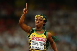 BEIJING, CHINA - AUGUST 24: Shelly-Ann Fraser-Pryce of Jamaica crosses the finish line to win gold in the Women's 100 metres final during day three of the 15th IAAF World Athletics Championships Beijing 2015 at Beijing National Stadium on August 24, 2015 in Beijing, China.