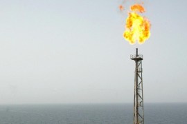 File picture dated May 16, 2004 shows a gas flame at the Balal offshore oil platform in the Gulf waters, in the Gulf on the edge of Qatar's territorial waters on May 16, 2004. The Balal offshore oil field was developed by French major Total together with BowValley of Canada and Italy's Agip. Under threat of US sanctions, European oil firms Total, Shell, Statoil and Eni have pledged to stop investing in Iran in what amounts to a 'significant setback' to Tehran, a US official said September 30, 2010.