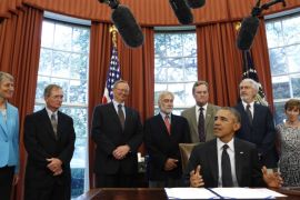 US President Barack Obama talks to the media before signing the Sawtooth National Recreation Area and Jerry Peak Wilderness Additions Act in the Oval Office at the White House in Washington on August 7, 2015. The act designates specified parcels of federal land in central Idaho as wilderness areas and as components of the National Wilderness Preservation System. AFP PHOTO/YURI GRIPAS