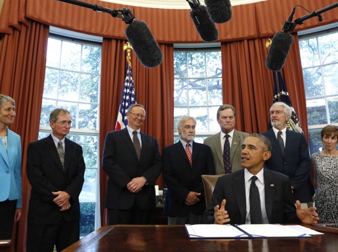 US President Barack Obama talks to the media before signing the Sawtooth National Recreation Area and Jerry Peak Wilderness Additions Act in the Oval Office at the White House in Washington on August 7, 2015. The act designates specified parcels of federal land in central Idaho as wilderness areas and as components of the National Wilderness Preservation System. AFP PHOTO/YURI GRIPAS