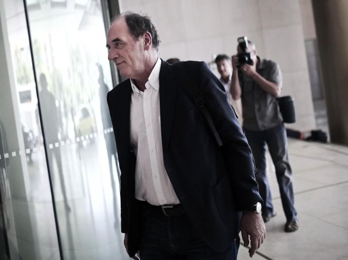 Greek Economy Minister Giorgos Stathakis arrives for a meeting with representatives of the International Monetary Fund at a hotel in Athens, August 9, 2015. Greece and its creditors resumed talks in Athens on August 9, 2015 with both sides indicating that the terms of a third bailout will be finalised in short order. AFP PHOTO / ANGELOS TZORTZINIS