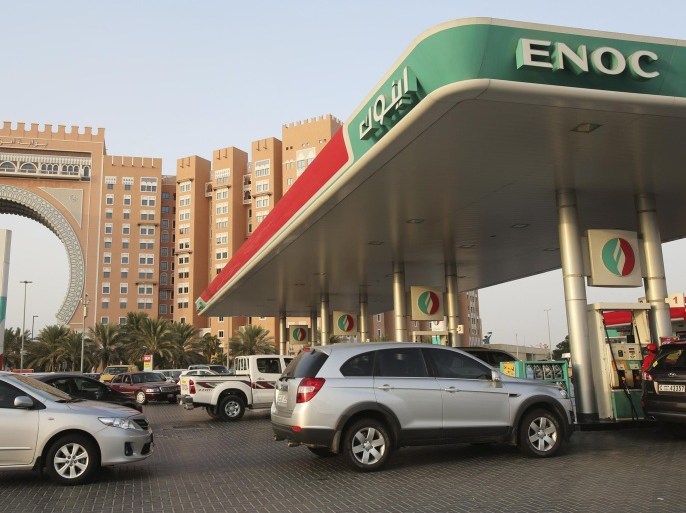 Vehicles wait to buy fuel at a petrol station on Wednesday, July 22, 2015, in Dubai, United Arab Emirates. UAE authorities plan to begin linking fuel prices to global prices starting Aug. 1. Gasoline prices are currently set by the government at subsidized rates, with a liter of regular gasoline selling for 1.72 dirhams (47 cents), or about $1.78 a gallon.(AP Photo/Kamran Jebreili)