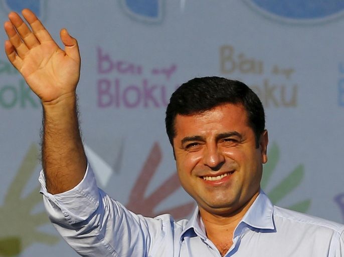 Selahattin Demirtas, leader of Turkey's pro-Kurdish opposition Peoples' Democratic Party (HDP), greets the crowd during a peace rally in Istanbul, Turkey, August 9, 2015. REUTERS/Murad Sezer