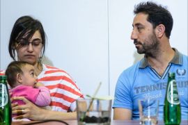 epa04845270 Syrian refugees Nahla Fadel (L) with daughter Sara and Adnan Saad (R) at Estera Foundation press conference in Warsaw, Poland, 13 July 2015