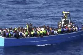 In this photo provided by the Swedish Coast Guard, migrants wait for help from the ship Poseidon after being spotted in a fishing boat off the Libyan coast Wednesday, Aug. 26, 2015. The Swedish ship Poseidon rescued 439 survivors aboard a wooden ship, discovering in the hull the corpses of 51 migrants who died, probably of asphyxiation, making the dangerous Mediterranean crossing in hopes of reaching Europe. (Swedish Coast Guard via AP Photo) MANDATORY CREDIT