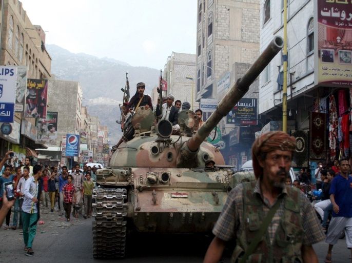 Militants loyal to Yemen's exiled government ride atop a tank they seized from Houthi militiamen in the country's central city of Taiz August 17, 2015. Militia forces loyal to Yemen's exiled government fought their way deep into the central city of Taiz on Sunday, local officials said, largely pushing out Houthi militiamen from the country's third largest city. REUTERS/Stringer TPX IMAGES OF THE DAY