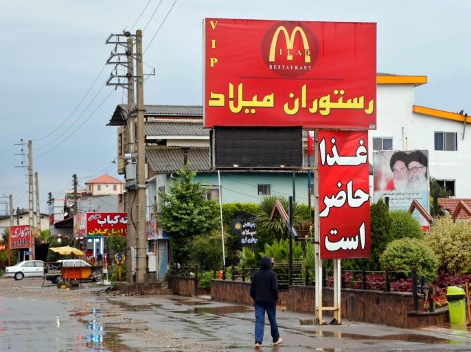 The sign of the Iranian restaurant Milad bearing a McDonald's logo in the city of Tone-Kabon, Mazandaran Province, northern Iran, 20 July 2015. McDonald's is very popular among Iranians, though forbidden from having branches in Iran, as it is believed by hardliners in Iran to be a symbol of US imperialism and capitalism. However, many fast food restaurants use the McDonald's logo on their signs to attract customers. Following the nuclear agreement and the improvement of ties between the two countries, there are reports that McDonalds has officially applied for a licence to open branches in the Islamic Republic.