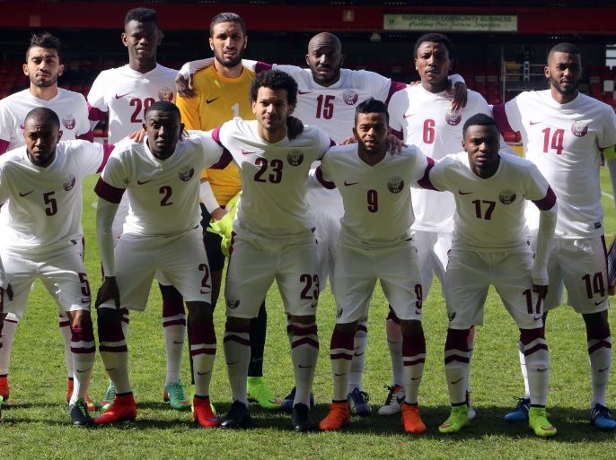 The Qatar national team pose before the international friendly football match between Qatar and Northern Ireland at the Alexandra Stadium in Crewe on May 31, 2015.AFP Photo/ Geoff Caddick