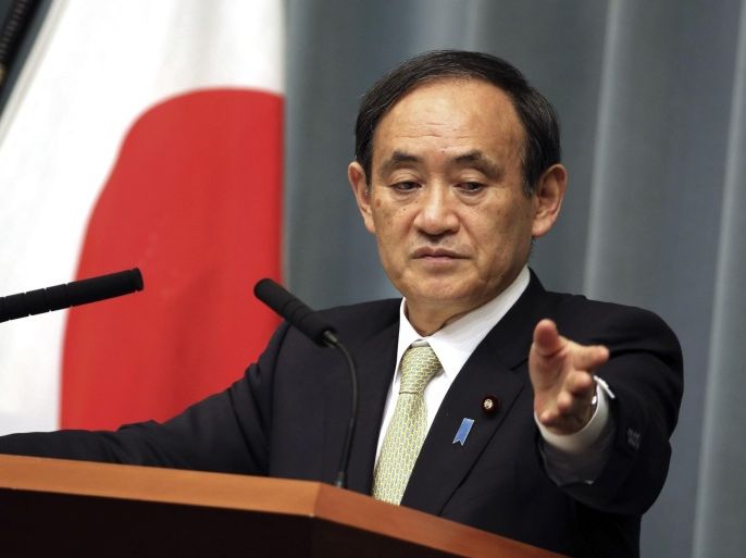 Japan's government spokesman Chief Cabinet Secretary Yoshihide Suga answers questions from journalists during a press conference at the prime minister's official residence in Tokyo, Friday, Jan. 30, 2015. (AP Photo/Eugene Hoshiko)