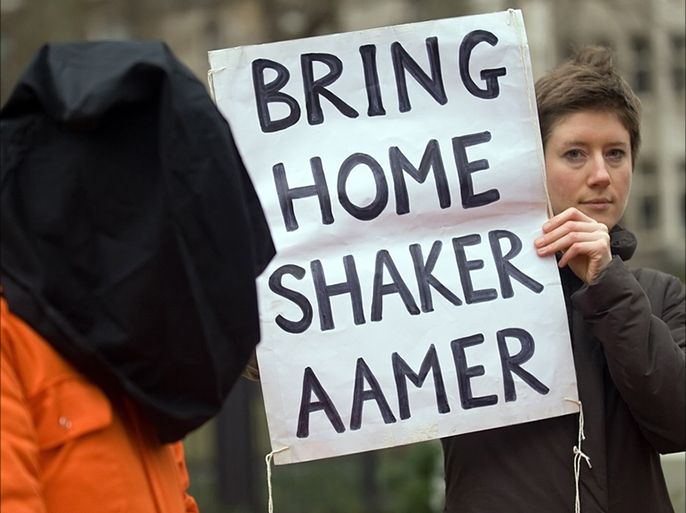 A protester holds up a sign calling for the release of Shaker Aamer from Guantánamo during a demonstration in central London in 2010. Photograph Leon Neal AFP Getty Images copy