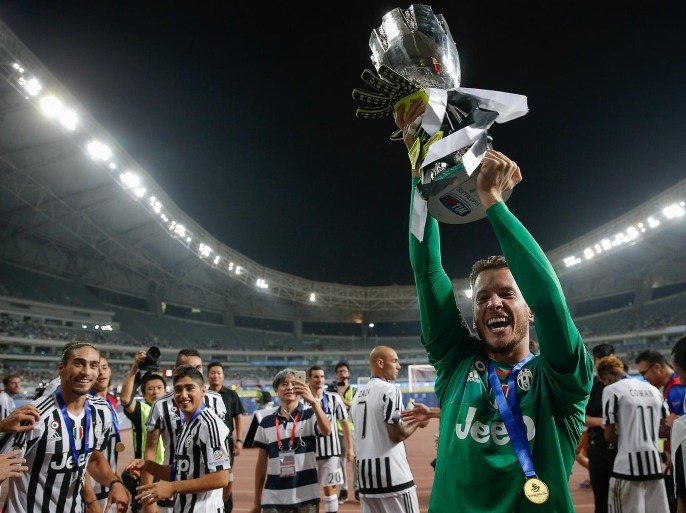 SHANGHAI, CHINA - AUGUST 08: Norberto Neto of Juventus celebrates with the trophy after winning the Italian Super Cup final football match between Juventus and Lazio at Shanghai Stadium on August 8, 2015 in Shanghai, China.