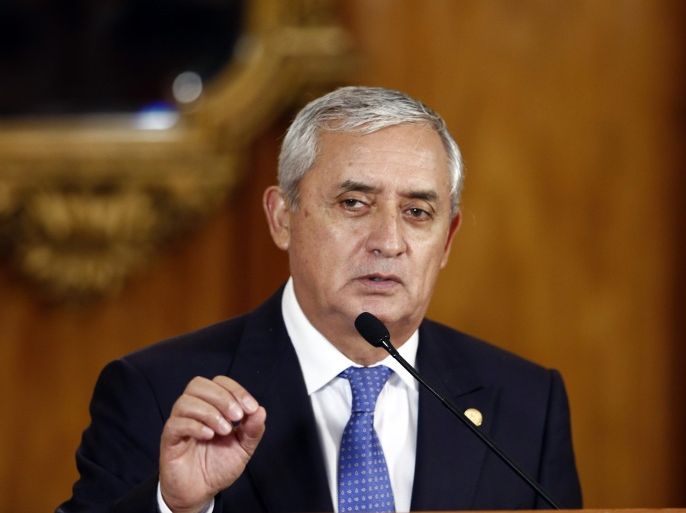 Guatemala's President Otto Perez Molina speaks during a press conference, in Guatemala City, Monday, Aug. 31, 2015. The president said Monday he understood protests calling for his resignation and will not interfere with demonstrations or the legal case against him, but insisted the country must go through with Sunday’s presidential elections. (AP Photo/Moises Castillo)