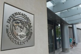 The seal of the International Monetary Fund is seen on a headquarters building in Washington, DC on July 5, 2015. The euro was dropping against the dollar after early results of the Greece bailout referendum suggested the country rejected fresh austerity demands from EU-IMF creditors. AFP PHOTO/MANDEL NGAN