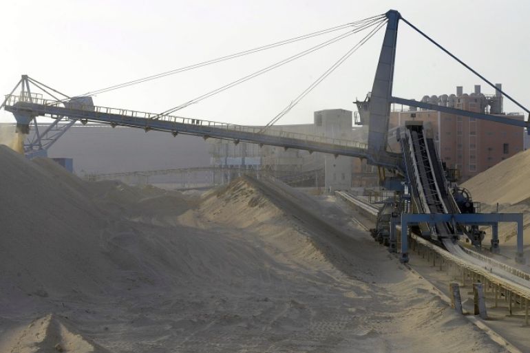 A picture taken on May 13, 2013 shows untreated phosphate being dropped off on a montain at the end of a conveyor belt at the Marca factory of the National Moroccan phosphates company (OCP/public), near Laayoune, the capial of Moroccan-controlled Western Sahara. As a global leader in the market for phosphate and its derivatives, OCP has been a key player in the international market since its founding in 1920, the worlds largest exporter of phosphate rock and phosphoric acid and one of the worlds largest fertilizer producers.