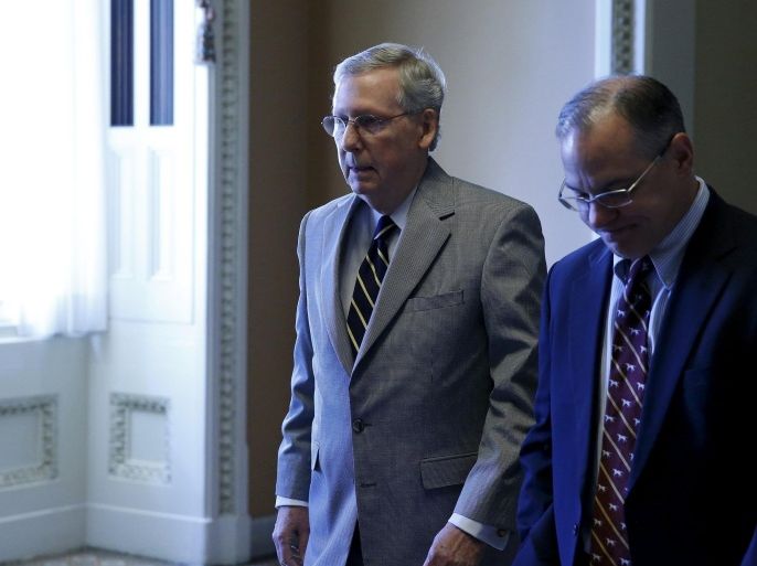 U.S. Senate Majority Leader Mitch McConnell (R-KY) (2nd R) returns to his office after delivering remarks on the Senate floor at the U.S. Capitol in Washington September 8, 2015. Three U.S. Democratic senators on Tuesday said they would back the nuclear deal with Iran, bringing the total number of lawmakers who have announced their support to 41 out of 100 senators. REUTERS/Jonathan Ernst