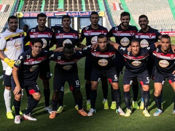 Tunisia's Etoile du Sahel's players pose before their CAF Confederation Cup group B football match against Egypt's al-Ahly at the Cairo International Stadium in the Egyptian capital on August 23, 2014. AFP PHOTO / MOHAMED EL-SHAHED