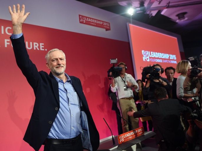 New Labour leader Jeremy Corbyn (L) waves following his announcement as the party's new leader at a Labour special conference in London, Britain, 12 September 2015. Veteran left-wing politician Corbyn was elected in a vote that was expected to swing the party to the left.