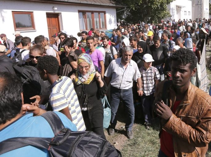 Migrants wait to enter a registration camp after they crossed between Serbia and Croatia near the city of Tovarnik, Croatia, 17 September 2015. Serbia's border with Croatia has become the latest flashpoint in Europe's refugee crisis as migrants sought alternative routes to Western Europe after Hungary slammed its doors shut. Hungary on 15 September sealed the last gap in the barricade along its border with Serbia, closing the passage to thousands of refugees and migrants still waiting on the other side and some groups decided to pass over Croatia.