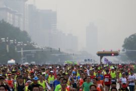 Participants run in the Beijing International Marathon in Beijing, China, September 20, 2015. About 30,000 runners participated in the annual running event. REUTERS/Kim Kyung-Hoon