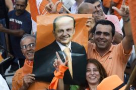 Supporters of Lebanon's Presidential candidate General Michel Aoun's Free Patriotic Movement party carry party flags and a picture of Aoun during a protest demanding reform and the right to national partnership, in Martyrs Square, Beirut, Lebanon, 04 September 2015. For over four hundred days Lebanon has been without a President since the mandate of Michel Suleiman lapsed, leading to political gridlock as factions failed to choose a suitable replacement, leading to crises such as the recent garbage issue which resulted in widespread protests calling for political reform.