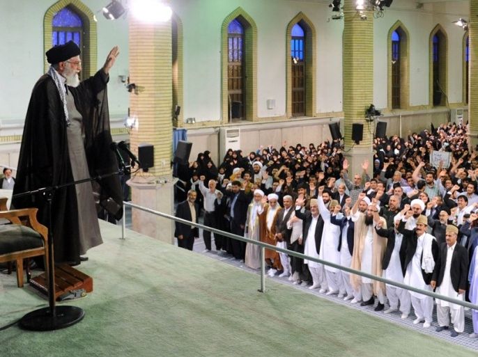A handout photo provided by the office of Iran's supreme leader Ayatollah Ali Khamenei shows him (L) waving to people during a meeting in Tehran on September 9, 2015. Khamenei said there will be no negotiations with the US beyond nuclear issue. AFP PHOTO / HO / KHAMENEI.IR ==RESTRICTED TO EDITORIAL USE - MANDATORY CREDIT "AFP