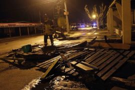 A Chilean firefighter walks next to wooden debris after a tsunami wave reached the shore in the village of Con Con near Valparaiso, Chile, late 16 September 2015. A strong earthquake of magnitude 8.3 rattled the Chilean capital Santiago and other regions of the country the US Geological Service reported. There were no immediate reports of casualties, and coastal areas around Chile were being evacuated for fear of a tsunami. First waves have reached the shore.